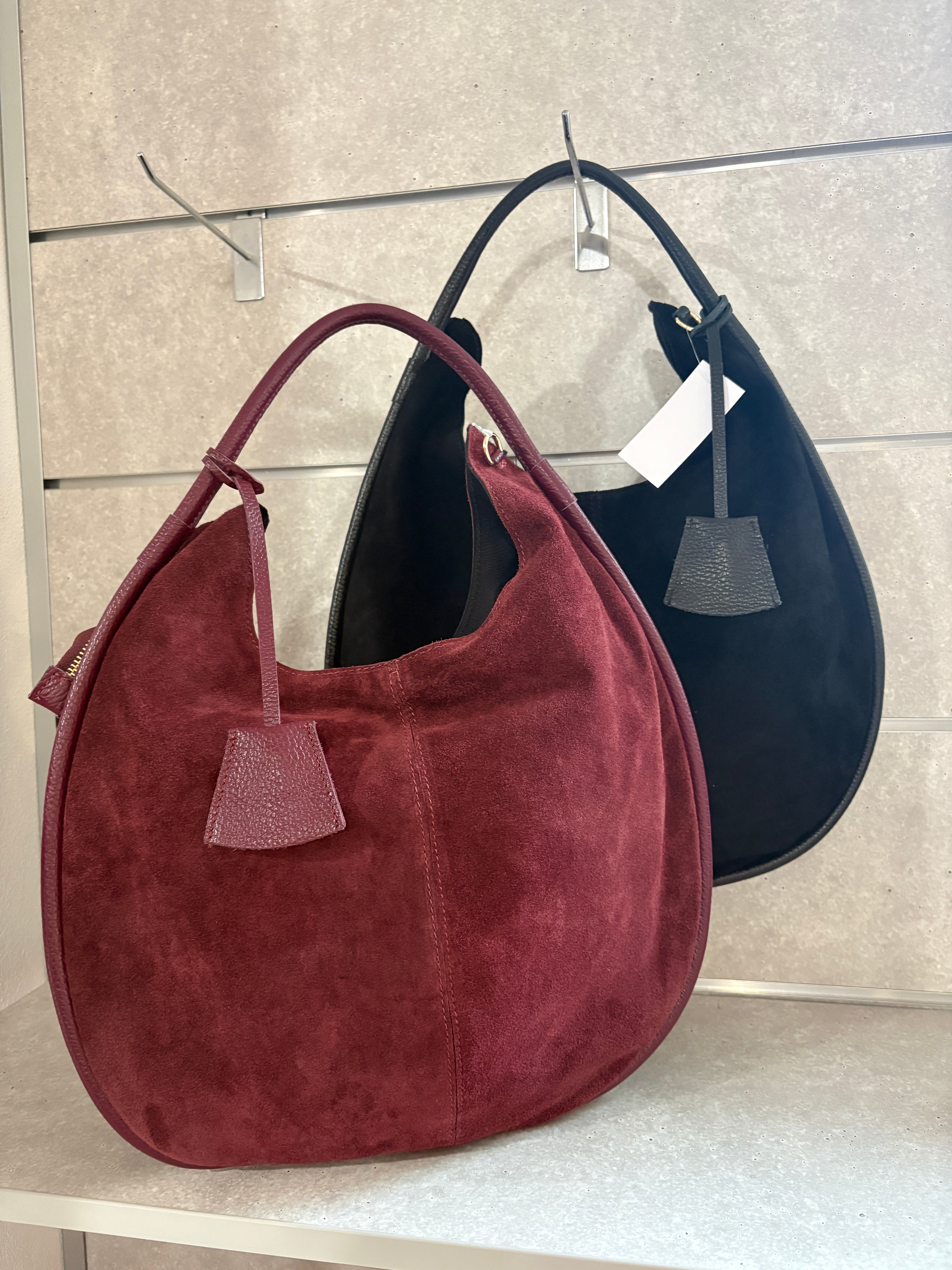 Borsa artigianale in camoscio e pelle di buccia d’arancia