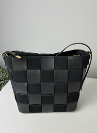 Borsa artigianale con design a scacchiera
