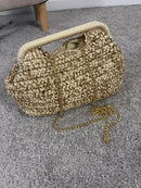 Borsa intrecciata con fili lurex e tracolla a catena