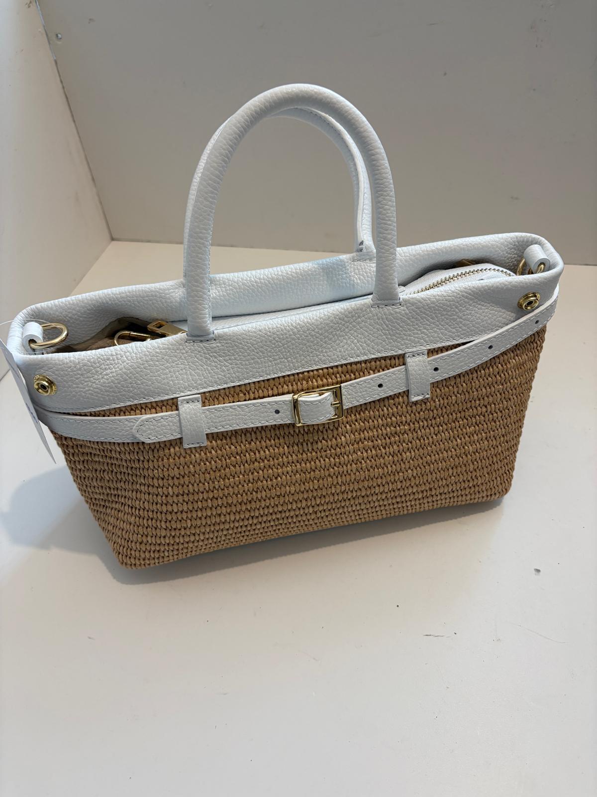 Woven bag with leather handles and shoulder strap