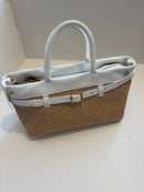 Woven bag with leather handles and shoulder strap