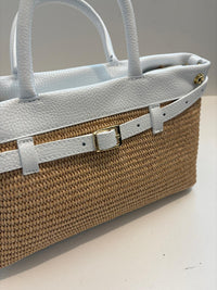 Woven bag with leather handles and shoulder strap