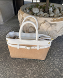 Woven bag with leather handles and shoulder strap