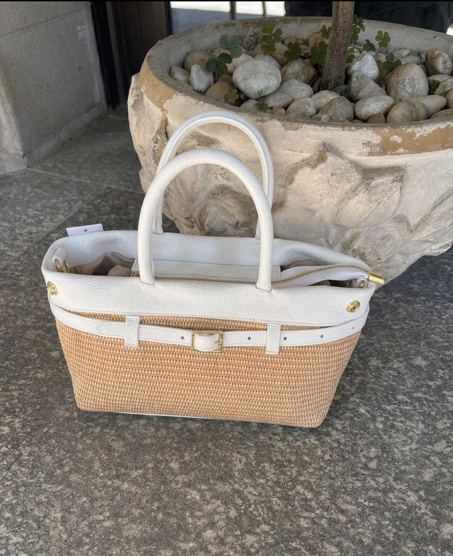 Woven bag with leather handles and shoulder strap