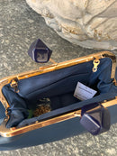 Borsa a mano in ecopelle con chiusura gioiello