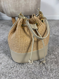Woven bucket bag with leather details