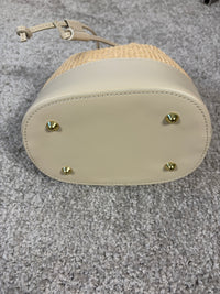 Woven bucket bag with leather details