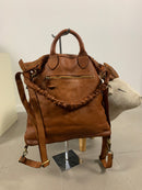 Borsa zaino toscana in pelle intrecciata con manico arricciato