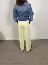 Yellow straight-leg jeans with frayed hem