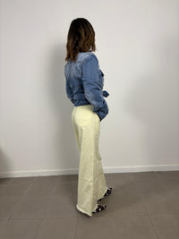 Yellow straight-leg jeans with frayed hem