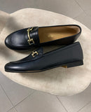 Mocassini Alessandra in pelle nera con fibbia dorata
