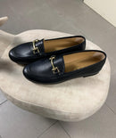 Mocassini Alessandra in pelle nera con fibbia dorata