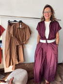 Pantalone in cotone con pieghe e elastico dietro