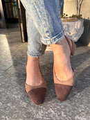 Two-tone dark brown and biscuit slingbacks with a tapered toe