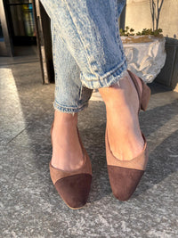 Two-tone dark brown and biscuit slingbacks with a tapered toe