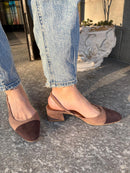 Two-tone dark brown and biscuit slingbacks with a tapered toe