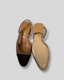 Two-tone dark brown and biscuit slingbacks with a tapered toe