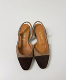 Two-tone dark brown and biscuit slingbacks with a tapered toe
